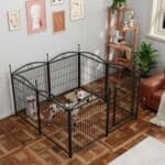 Black metal dog playpen with Dalmatian and small dog inside, on parquet floor in a modern living room with art, shelving, plants, and leather armchair.
